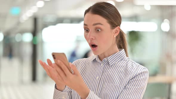 Portrait of Young Woman Having Loss on Smartphone 