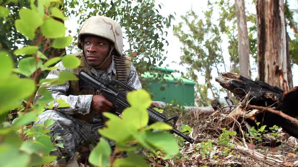 Military soldier guarding with a rifle