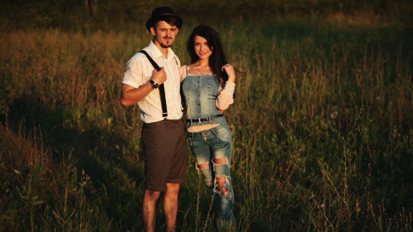 Loving couple posing At Aunset Country And Nature