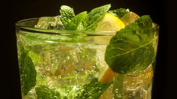 Glass of Cocktail with Lemon, Mint, Ice