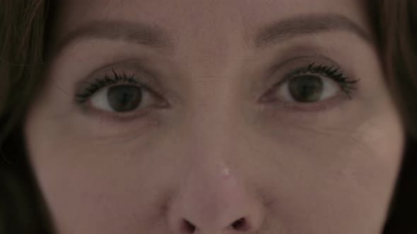 Close Up of Blinking Eyes of Old Woman at Camera