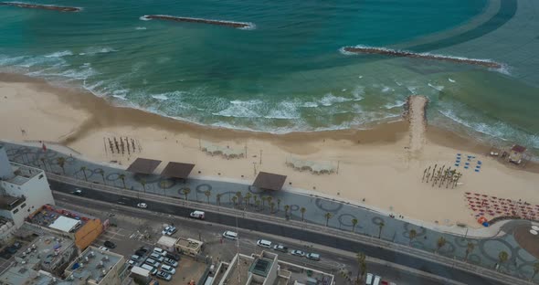 Timelapse of Waves, Car and People Traffic on Sea-front. Tel Aviv, Israel