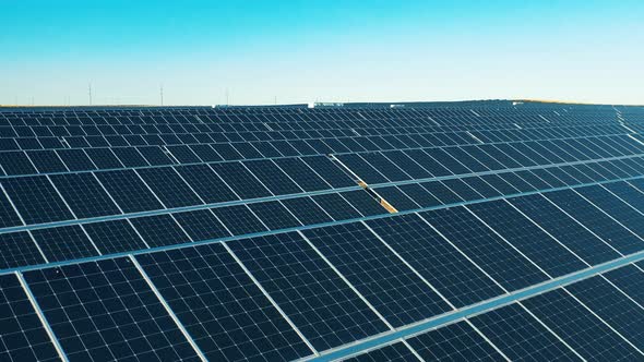 Aerial View of a Solar Power Facility Located in a Field