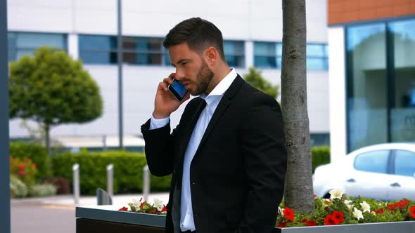 Businessman talking on mobile phone