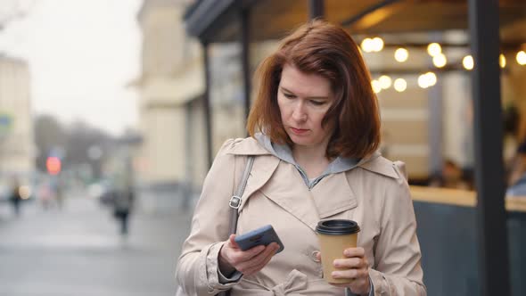 Woman Calling on Phone While Walking in City