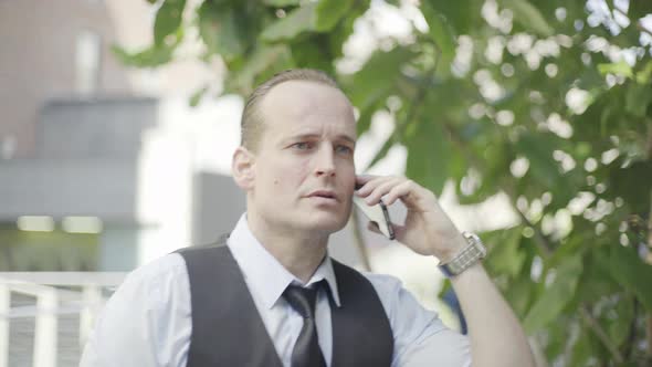 Businessman having discussion on cell phone