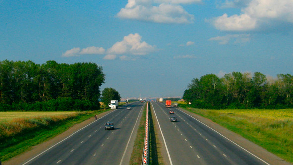Cars Traveling On The Highway In Day