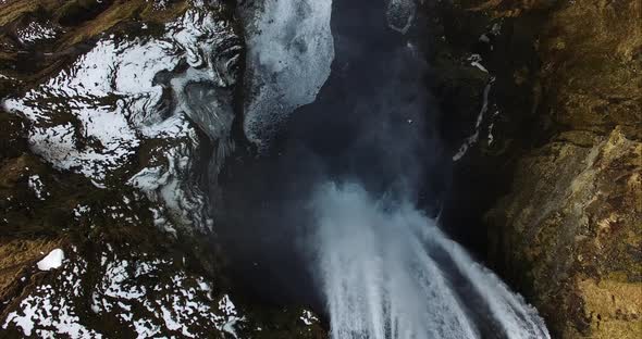 Powerful waterfall in snowy countryside