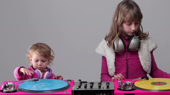Two Girls Playing with Record Players