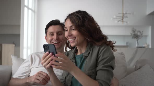 Married Woman and Man Smile Happily Reading Good News