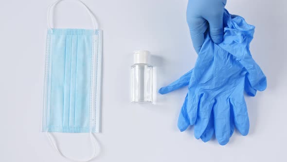 White Medical Masks and Respirators with Glove Hand Sanitizer on White Background