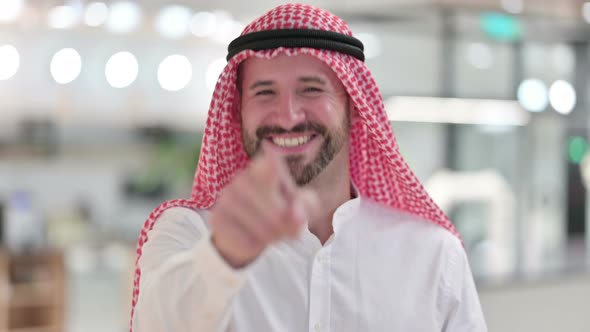 Assertive Arab Businessman with Pointing at the Camera