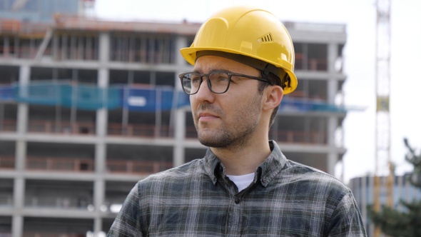 Supervisor Using Electronic Tab on Construction Site