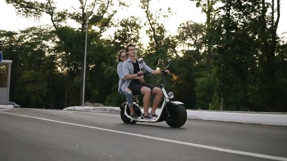 Side View of a Couple Riding on Bicycles and Having Fun