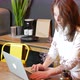 Young Woman Using Laptop at Kitchen - VideoHive Item for Sale