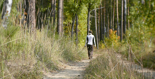 A Woman Walks In The Forest alt
