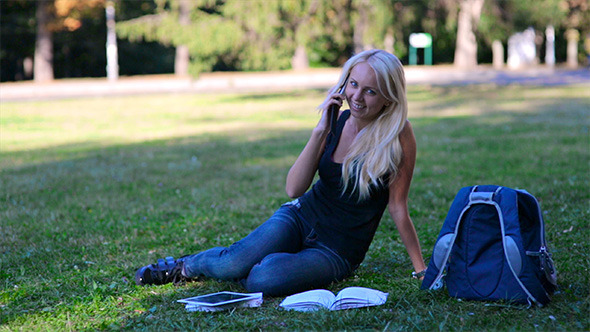 Pretty Female Student Talking by Cellphone alt