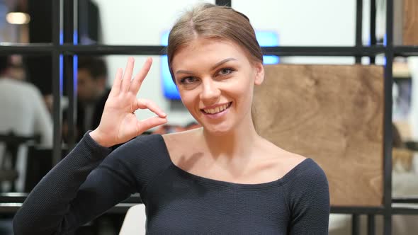 Young Girl Showing Ok Sign, Portrait