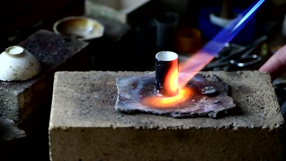 Closeup of Wedding Ring Polishing By Caicasian Jeweler Isolated  Footage