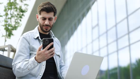 Joyful Guy Reading Good News on Smartphone Surprised Male Celebrating Victory on Smart Phone