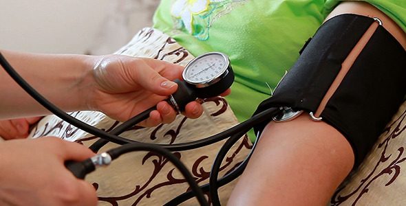 Blood Pressure Check to Senior Woman