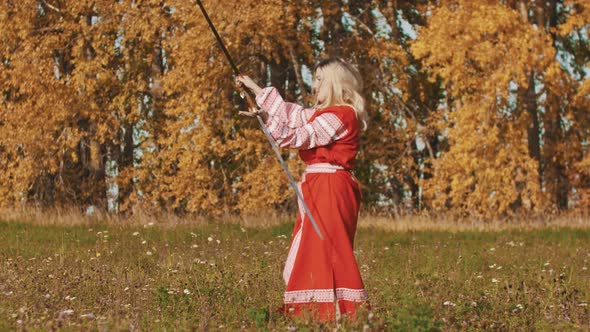 Medieval Concept - Woman in Red National Long Dress Masterfully Wields Swords - Rotating Them Around