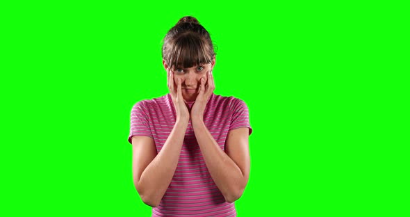 Front view of an incomprehensible Caucasian woman with green screen