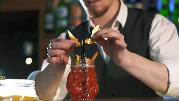 The Bartender Is Preparing an Alcoholic Cocktail.