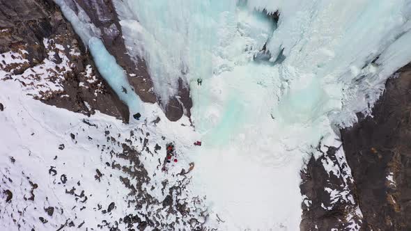 Ice Climbing on Frozen Waterfall