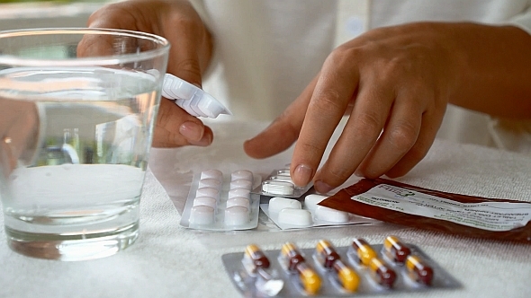 Girl Taking Pills and Tablets