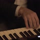 Pianist hands in a black suit playing the piano. - VideoHive Item for Sale