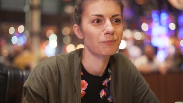 Smiling Girl Having Dinner with Friend Eating Food with Chopsticks