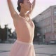 Graceful Ballerina Enjoys Dancing in City Center at Sunrise - VideoHive Item for Sale