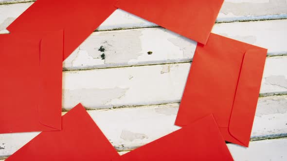 Red envelopes decorated on wooden plank