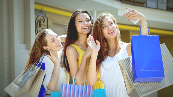 Beautiful Smiling Girl With A Bag Of Shopping