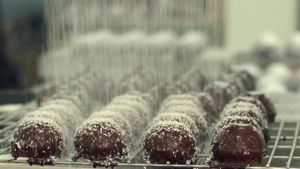 Coconut pouring over chocolate chip cookies