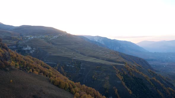 Valley with Mountains Covered with Autumn Forest and Fields