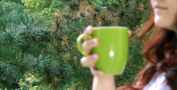 Young Girl Drinking Coffee and Nature