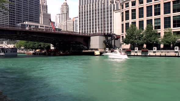 Time lapse of heavy boat traffic on the Chicago River on a sunny day