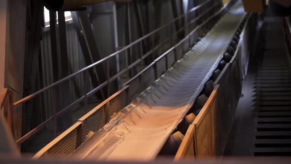 Close up of conveyor belt with white cloth