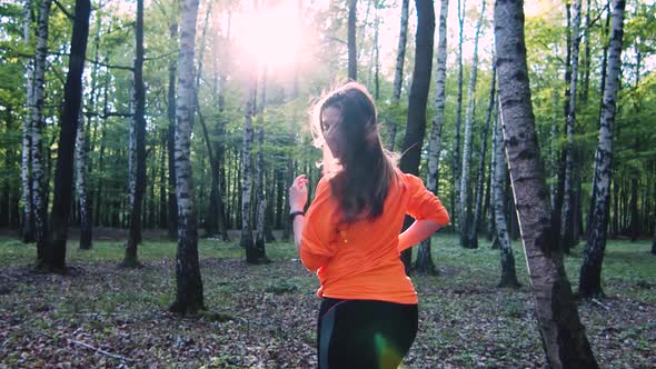 Athlete Girl Running in the Forest