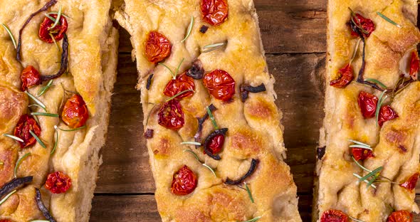 Traditional Italian Focaccia with pepperoni, cherry tomatoes, black olives, rosemary ando onion - ho