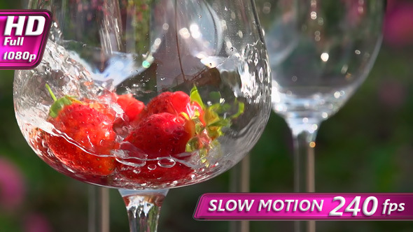 Water is Pouring into a Glass with Strawberries