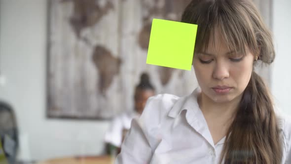 Business Woman Using Sticky Notes Solving Strategy on Glass Whiteboard