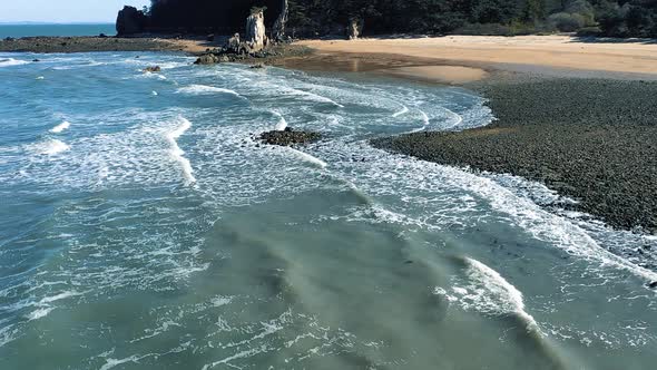 Stone beach and waves aerial shot