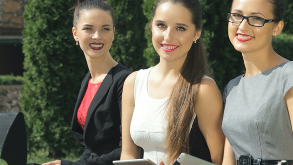 Three Girls Discuss Business Concluded Contract