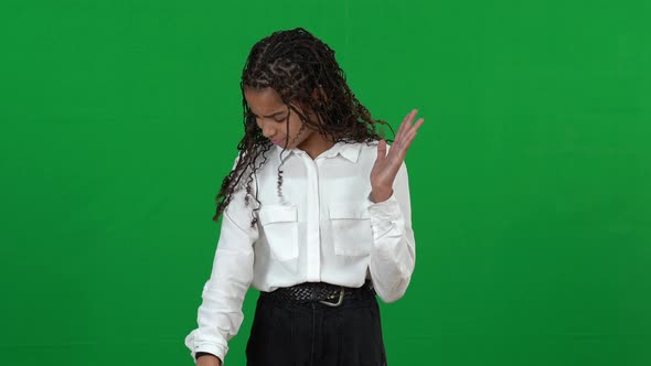 Stressed Sad African American Teenage Girl Itching on Green Screen