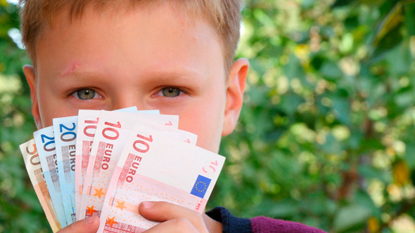 Boy Smelling Euro Notes 2