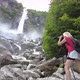 Woman Photographer at Foroglio Waterfall - VideoHive Item for Sale