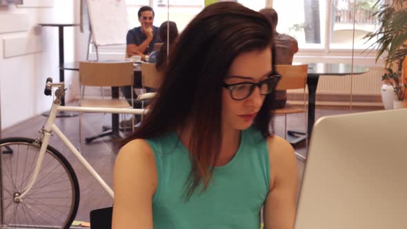 Portrait of beautiful female executive working at her desk